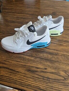 Nike White Sneakers with Black Swoosh and Teal & Neon Yellow Accents